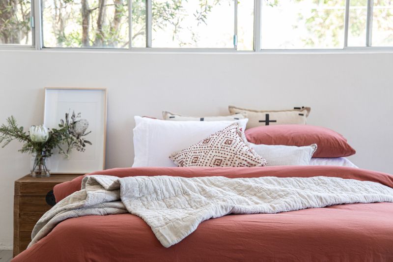 Red quilt on bed